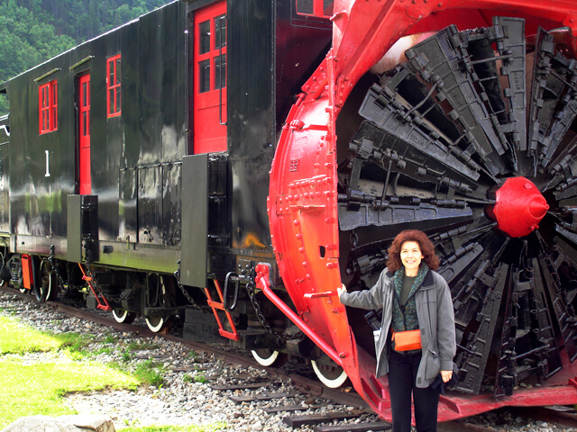 "Black and red train snowblower train of the While Pass & Yukon Railway in Skagway, Alaska""