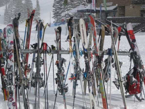 "Skis on the racks at Alta, Utah"