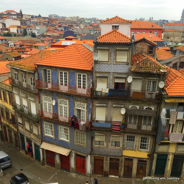 Red-tiled roofs cover the colorful buildings of Porto