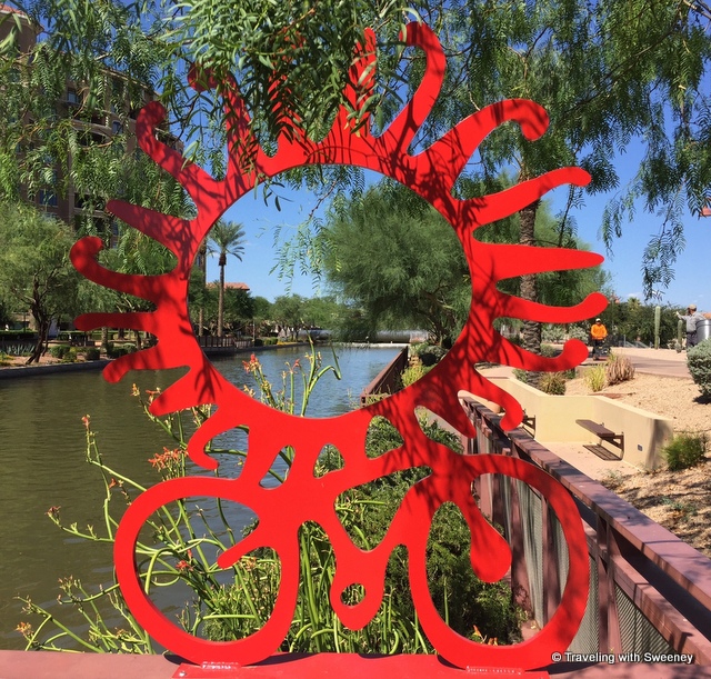 Red Metal bike and sun sculpture on the Scottsdale Waterfront