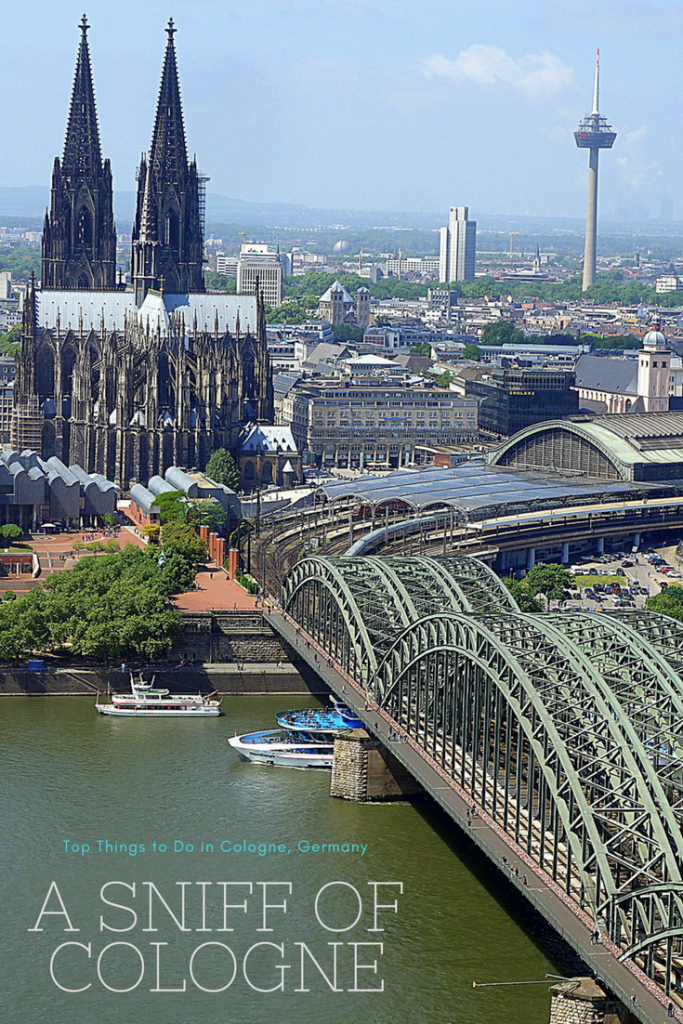 View of Cologne Cathedral, Central Station, and the Hohenzollen Bridge from the KölnTriangle in Cologne, Germany