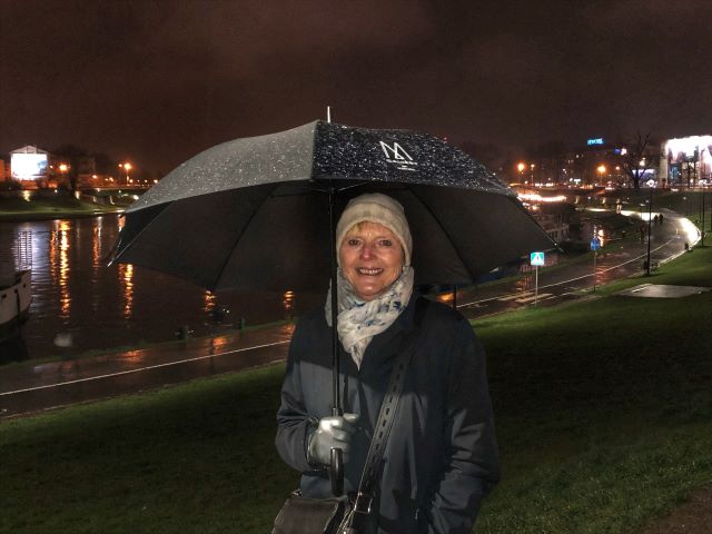 Walking along the Vistula River at night in the rain, Krakow, Poland