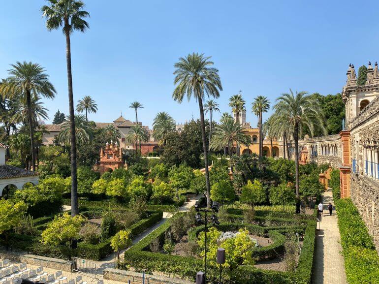 Palm trees and gardens of Real Alcazar in Seville, Spain
