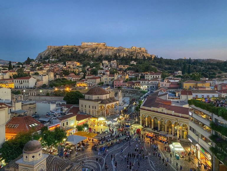 View of Monastiraki Square and the Acropolis at night from A For Athens rooftop bar and restaurant in Athens, Greece