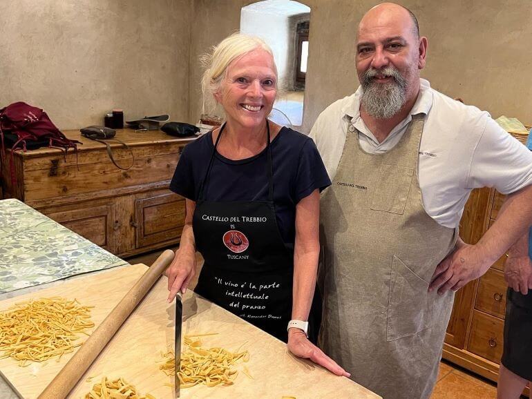 Catherine Sweeney with the cook at Castello del Trebbio in Tuscany during cooking lesson during Viking Mediterranean cruise