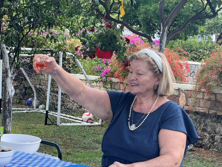 Toasting with kumquat liqueur at lunch on a hilltop in Corfu on a Viking shore excursion