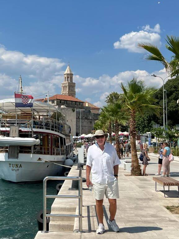 Mr. TWS of Traveling with Sweeney walking along the port of Split, Croatia on a Viking Mediterranean Odyssey cruise