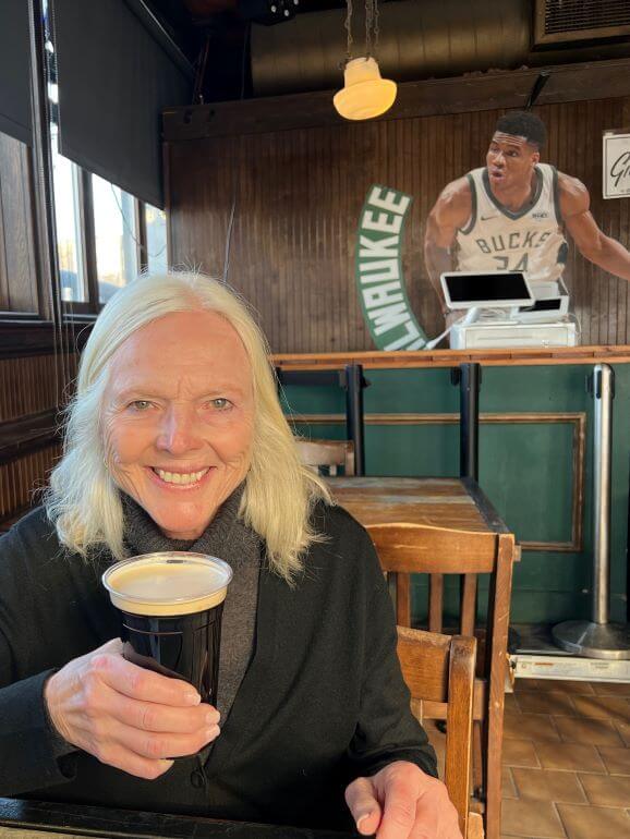 Catherine Sweeney drinking a Guinness at The Harp Irish pub in Milwaukee, Wisconsin