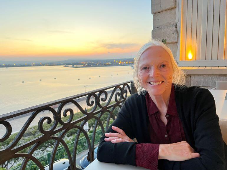 Catherine Sweeney at Kaleido Terrace restaurant with a view on Ortigia Island in Siracusa, Sicily, Italy