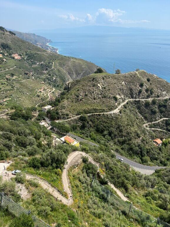 Winding roads below Castelmola, the picturesque town above Taormina, Sicily, Italy