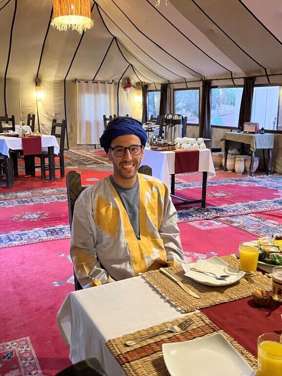 Tour manager Nabil Merri in the dining tent of a luxury camp on the Sahara Desert, Morocco
