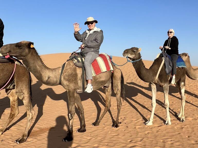 Traveling with Sweeney duo on camels in the Sahara Desert in Morocco
