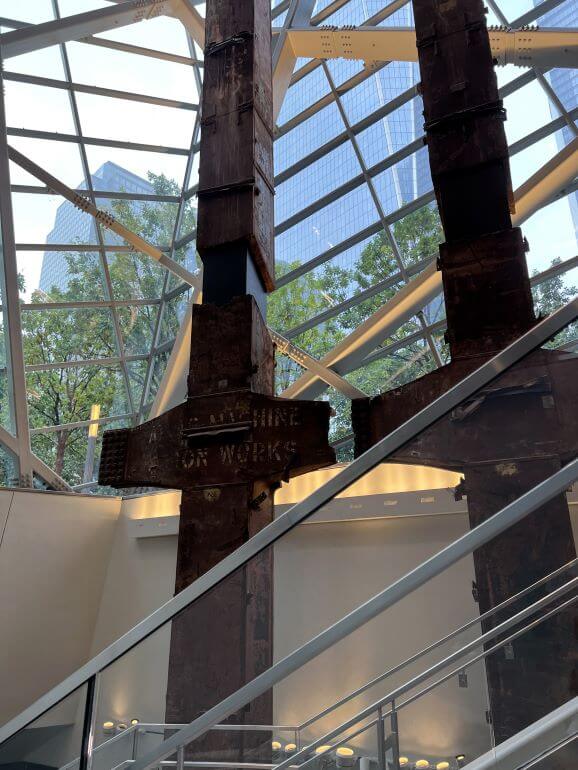 Two of the remaining beams that were recovered from the rubble of the World Trade Center twin towers. Seen from the stairs and escalator going down 70 feet to the exhibits