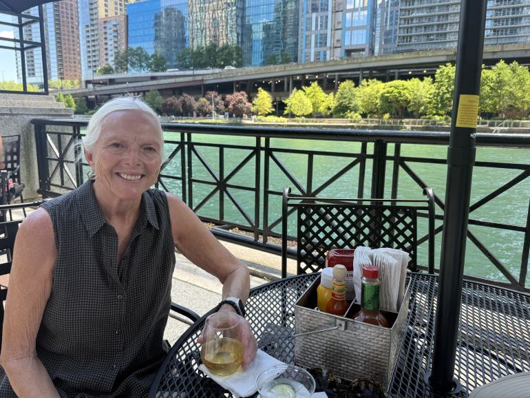 Catherine Sweeney enjoying a beverage outside along the Riverwalk in Chicago, Illinois