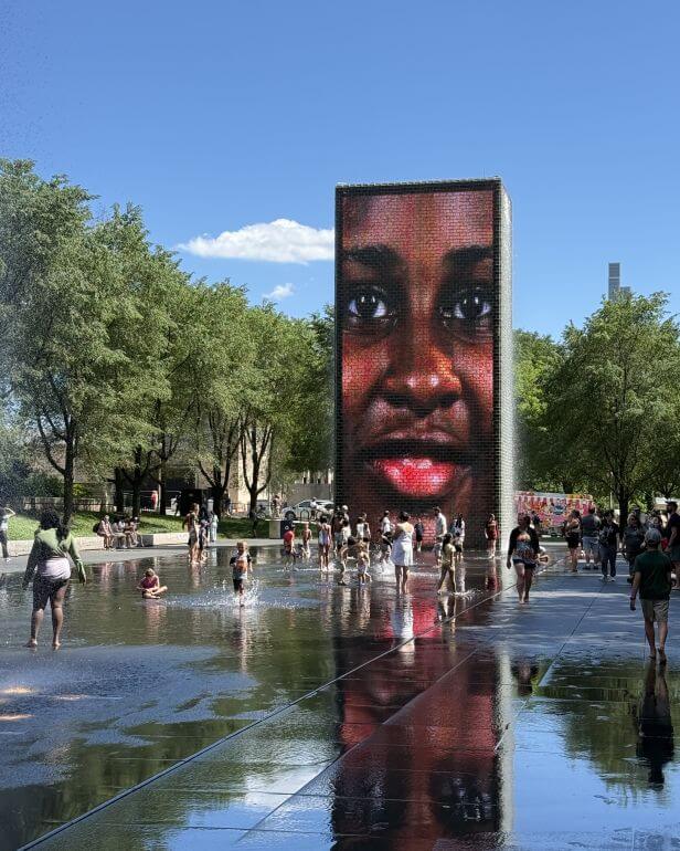 One of two tower fountains at each end of the shallow pool at Millennium Park Chicago, Illinois consists of two 50-foot glass block towers at each end of a shallow reflecting pool. The towers project video images from a broad social spectrum of Chicago citizens