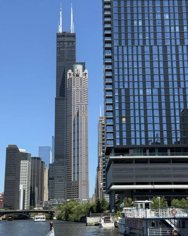 Willis Tower (building with two white broadcast antennas) seen from the Chicago River -- Chicago, Illinois